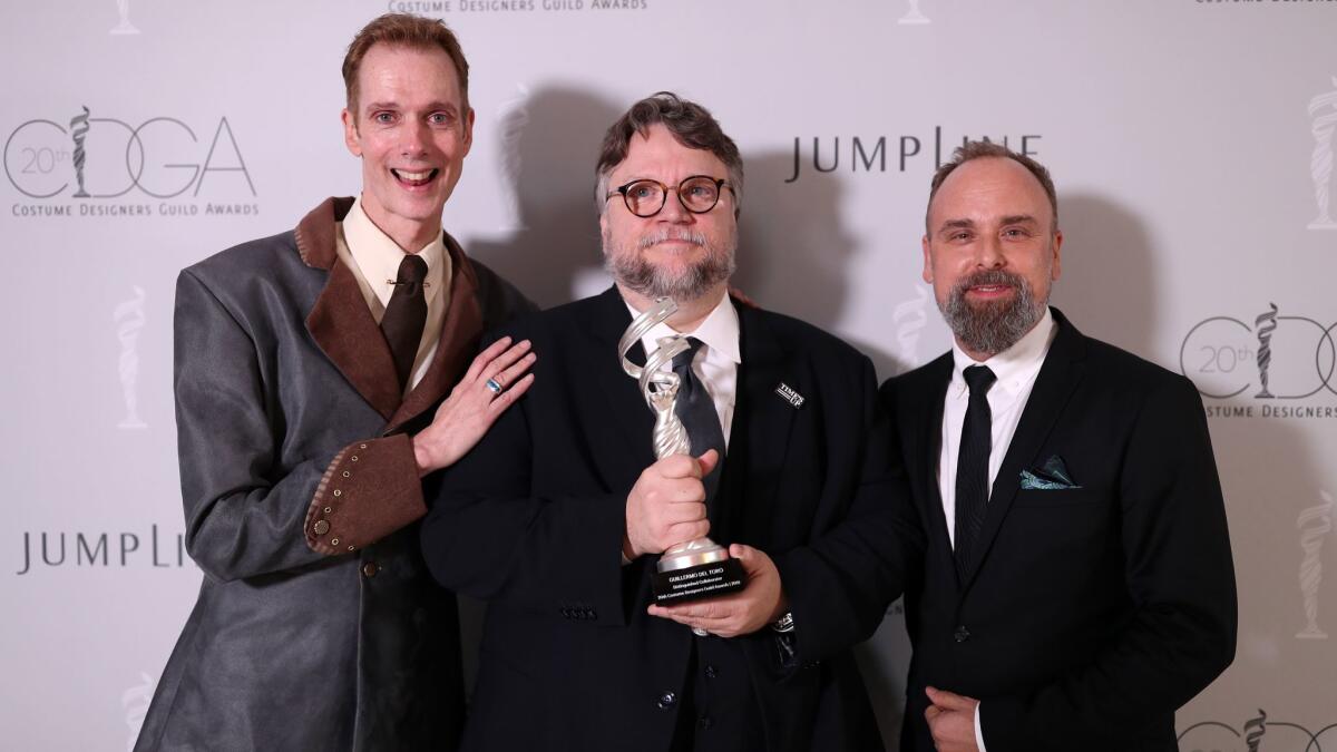 "The Shape of Water" actor Doug Jones, from left, director Guillermo del Toro, recipient of the Distinguished Collaborator Award at the Costume Designers Guild Awards, and costume designer Luis Sequeira attend the Costume Designers Guild Awards on Tuesday.