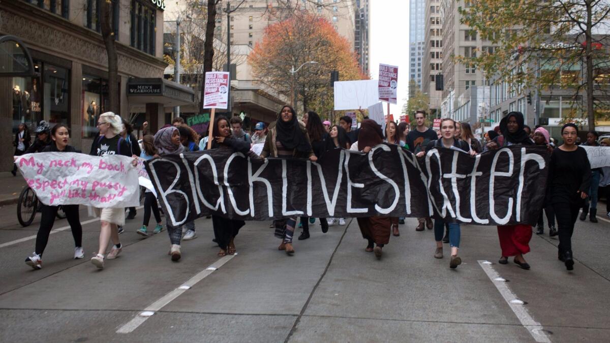 Protesters carry a "Black Lives Matter" banner as they march through downtown Seattle in November.