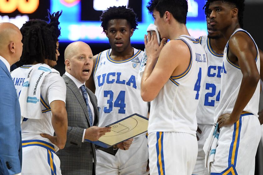 LOS ANGELES, CA - FEBRUARY 29: Tyger Campbell #10, David Singleton #34, Jaime Jaquez Jr. #4, Jalen Hill #24 and Chris Smith #5 of the UCLA Bruins listen as head coach Mick Cronin talks during a timeout in the second half of the game against the Arizona Wildcats at Pauley Pavilion on February 29, 2020 in Los Angeles, California. (Photo by Jayne Kamin-Oncea/Getty Images) ** OUTS - ELSENT, FPG, CM - OUTS * NM, PH, VA if sourced by CT, LA or MoD **