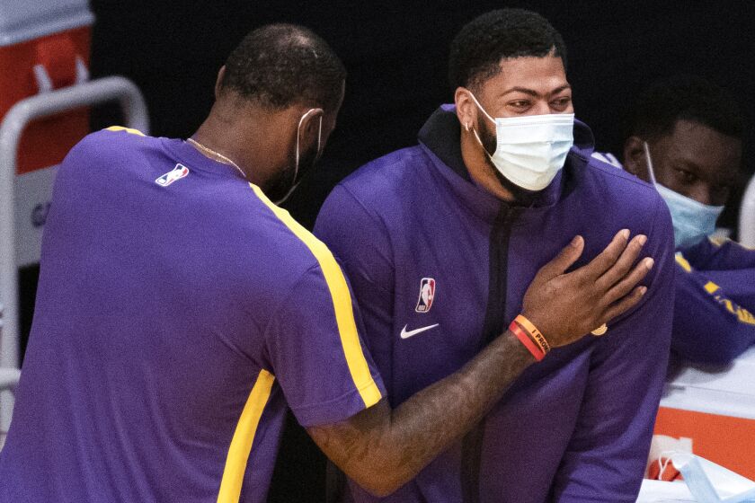 Los Angeles Lakers forward LeBron James, left, and forward Anthony Davis joke around.