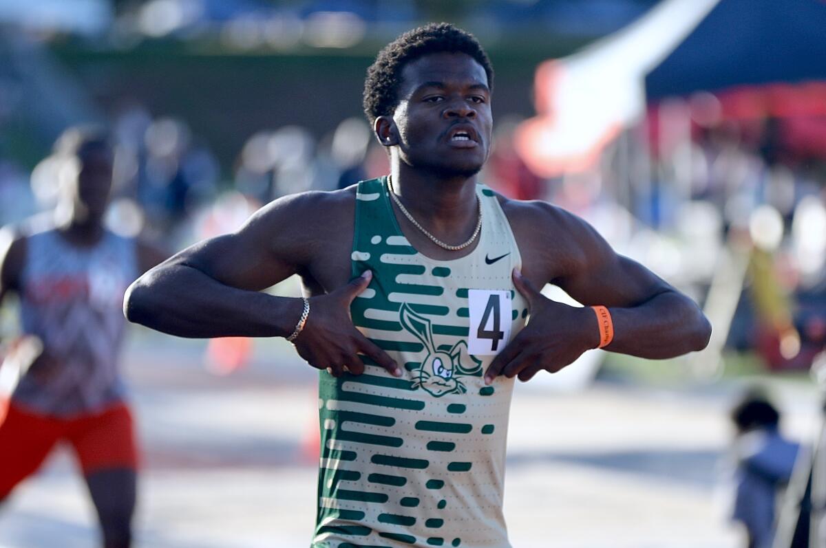 Long Beach Poly's Xai Ricks celebrates after winning the state title in the boys' 400 meters.