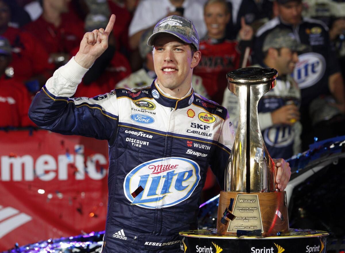 Brad Keselowski celebrates after winning Saturday's NASCAR Sprint Cup race at Charlotte Motor Speedway.