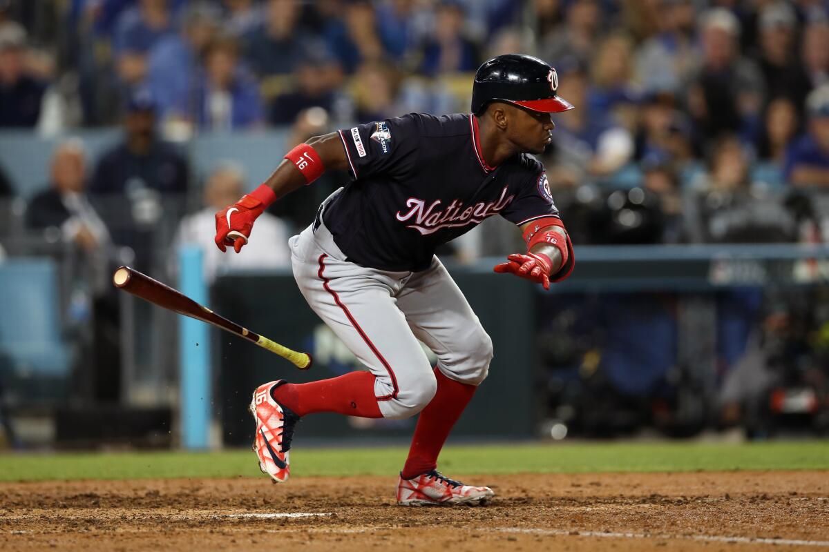 Washington's Victor Robles runs after putting down a sacrifice bunt during the eighth inning of Game 2 of the NLDS on Friday.
