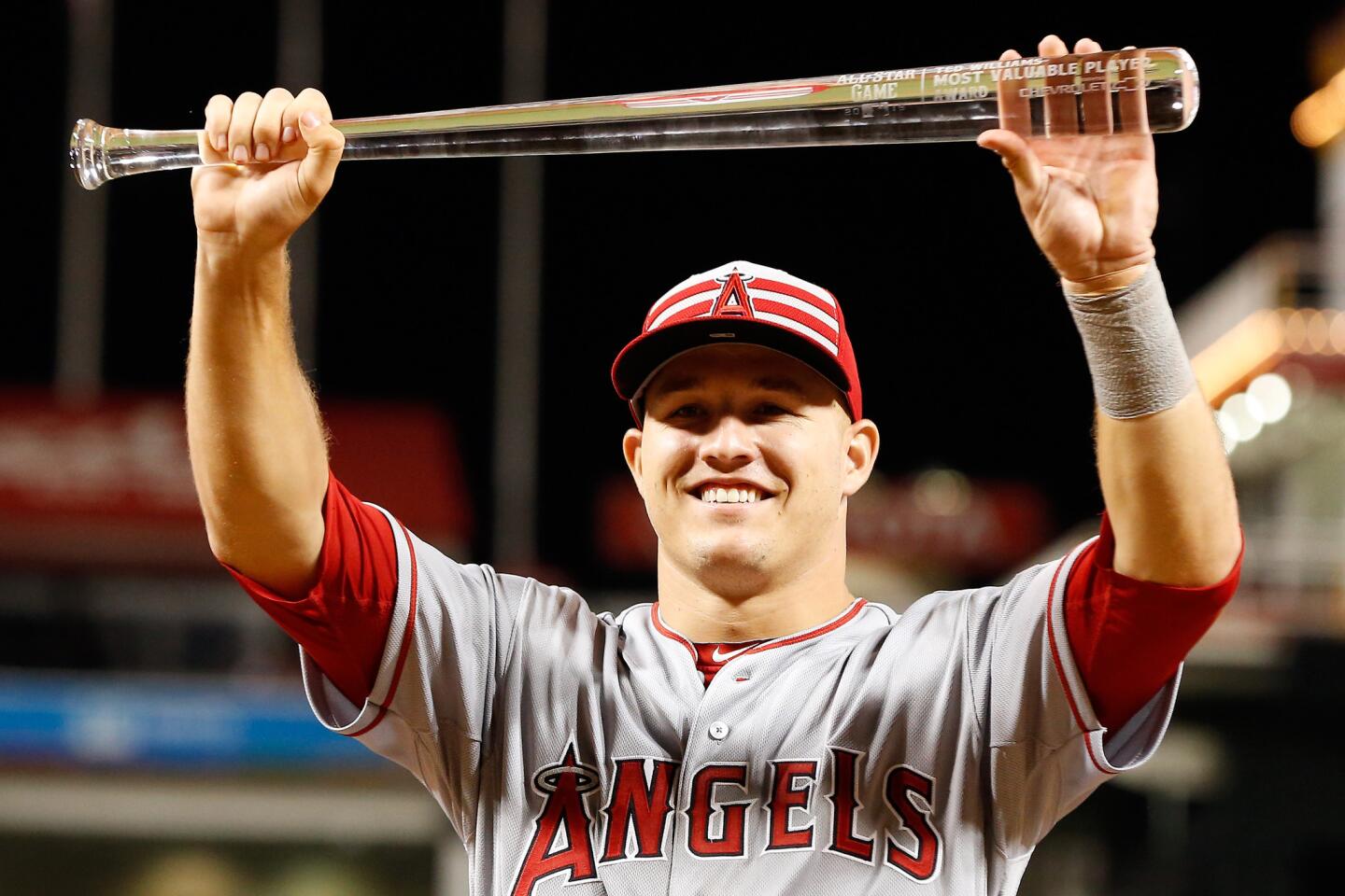 American League All-Star Mike Trout poses with the MVP trophy after defeating the National League 6-3.