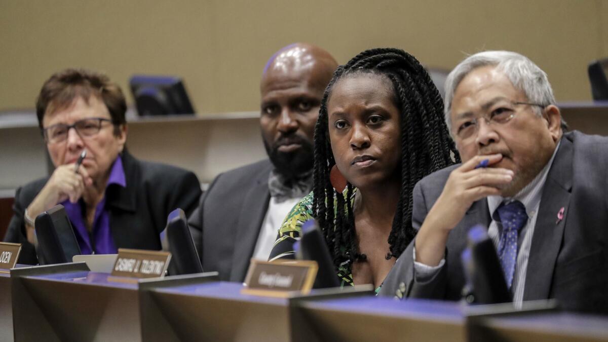 Sheriff Civilian Oversight Commission Chair Patricia Giggans, left, executive director Brian Williams, Vice Chair Priscilla Ocen and commissioner Casimiro Tolentino at a meeting of the panel on Thursday.