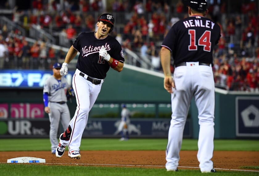 Ryan Zimmerman of the Washington Nationals celebrates after hitting a three-run homer against Dodgers pitcher Pedro Baez.