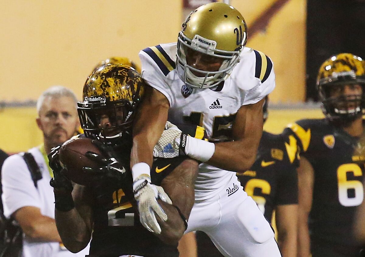 Arizona State receiver Jaelen Strong makes a catch in front of Bruins defensive back Priest Willis during the second quarter of a game on Sept. 25.