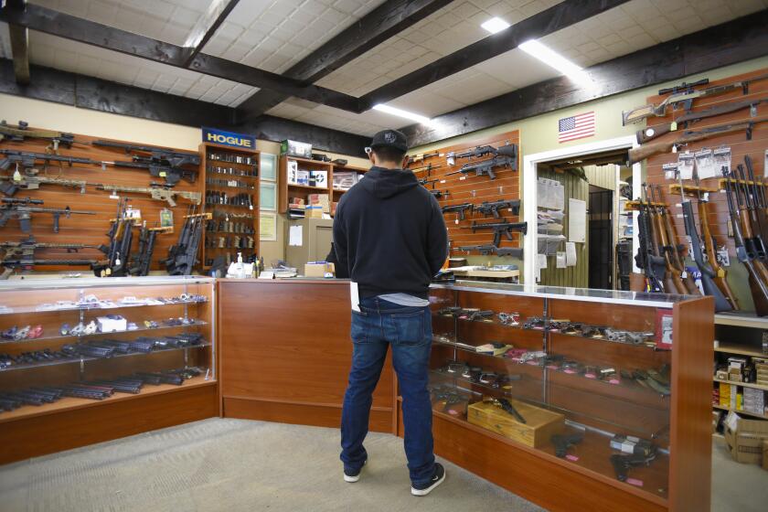 Will Gonzalez from El Cajon filled out the necessary paper work to purchase a rifle at AO Sword Firearms in El Cajon on Thursday March 19, 2020. Gonzalez is among the increase of recent firearm sales across the county. David Chong, owner of AO Sword Firearms says that of the increase in firearm sales at his store, 90% of the increase in business is from new gun owners.