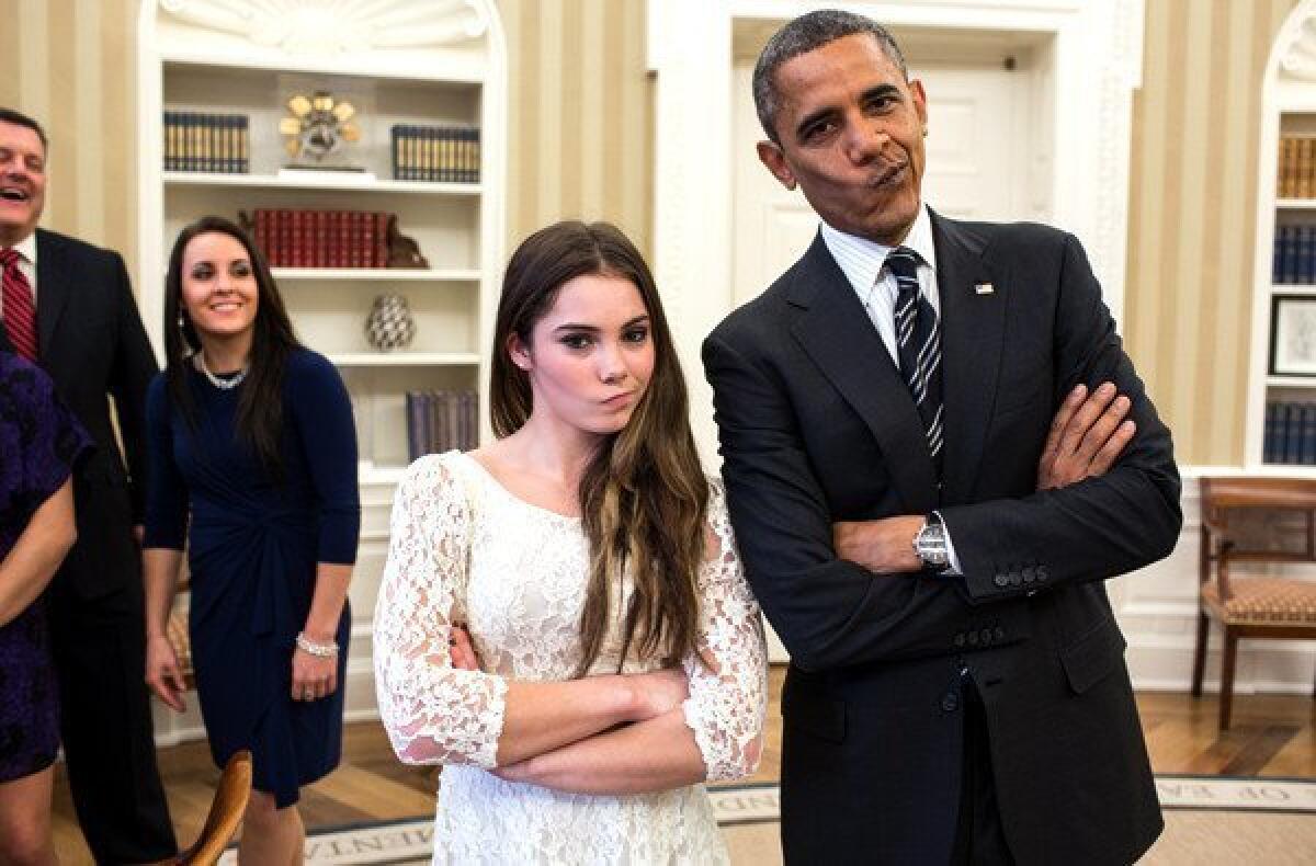 President Obama strikes the "not impressed" pose with Olympic gymnast McKayla Maroney on Thursday in the Oval Office of the White House.