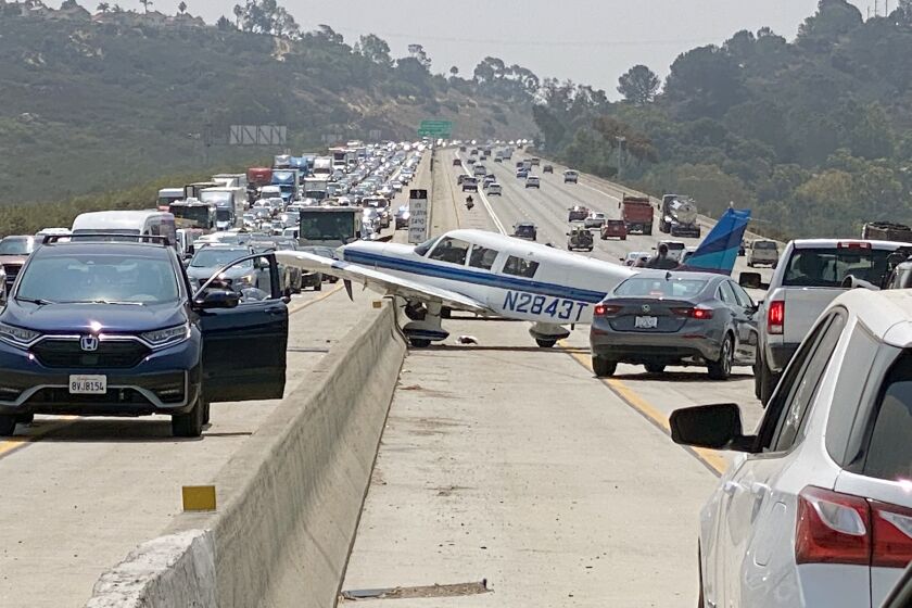 A small single engine plane made an emergency landing on the southbound I-5 freeway near Del Mar