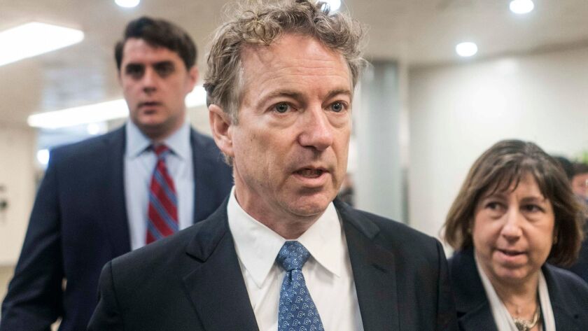 Sen. Rand Paul briefly speaks to reporters on Capitol Hill on Thursday.