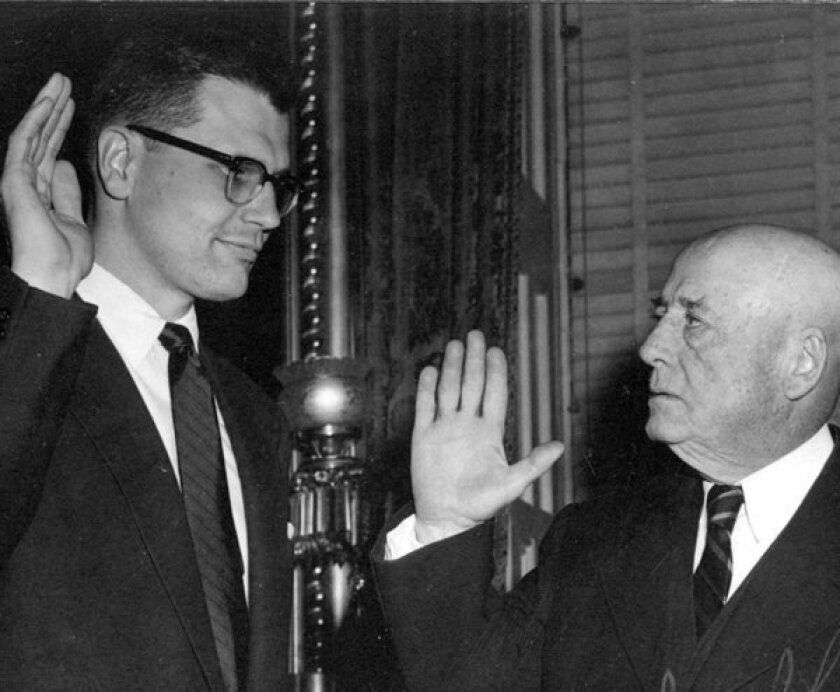 This 1955 file photo shows Rep. John Dingell (D-Mich.) being sworn in by mentor and former Speaker of the House Sam Rayburn of Texas in 1955.