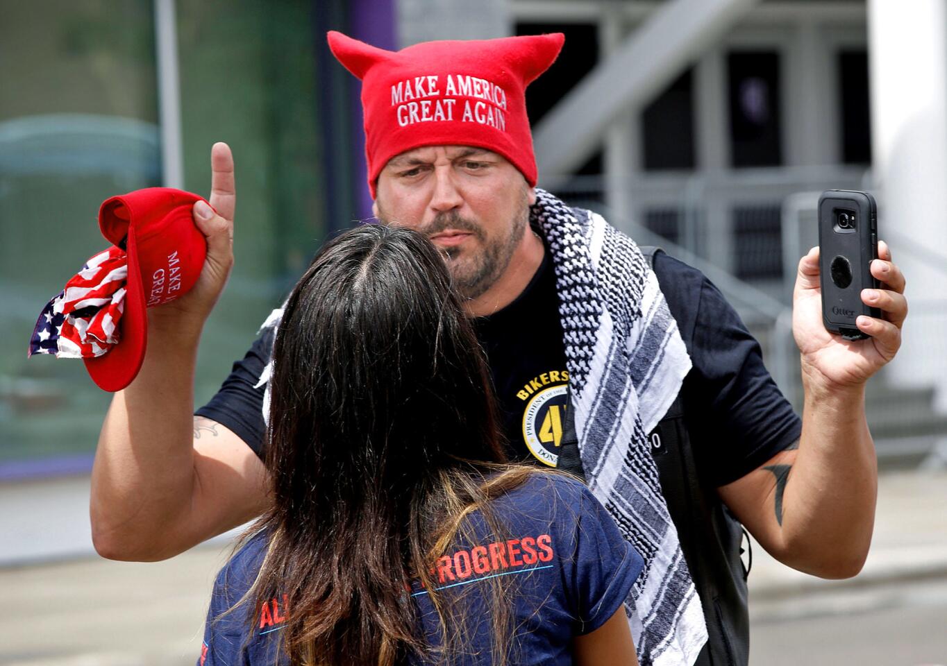 A Trump supporter faces off with a protester in Orlando.