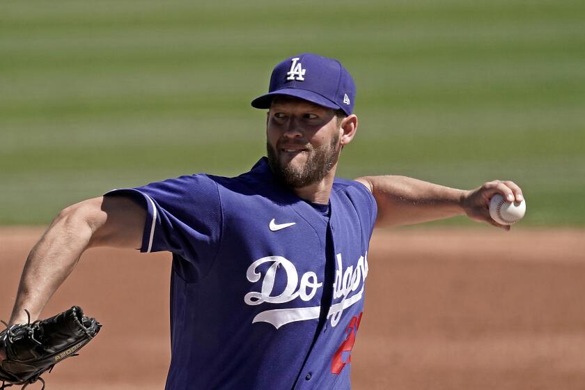 Dodgers left-hander Clayton Kershaw pitches during a spring training game against the Cleveland Guardians on March 23, 2022.