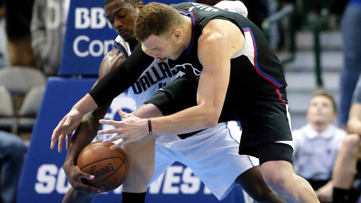 Mavericks forward Harrison Barnes steals the ball from Clippers forward Blake Griffin in the final seconds of their game Thursday night.