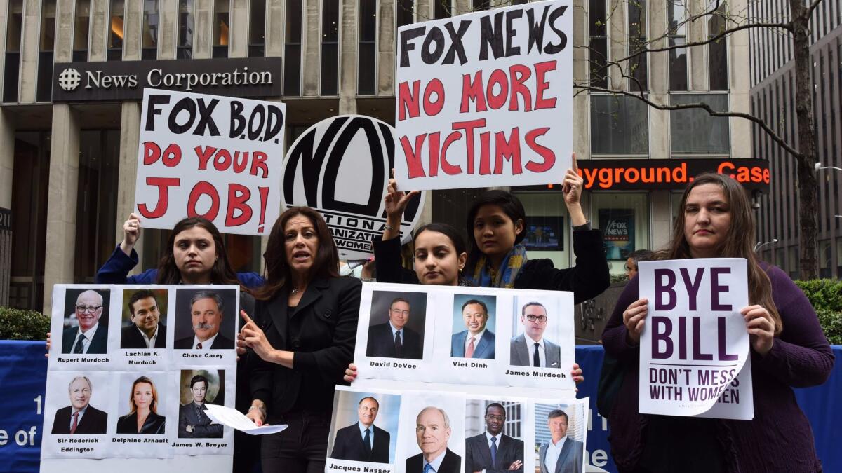 Protestors from the National Organization for Women of New York rally April 20, the day after Fox News cut ties with Bill O'Reilly.