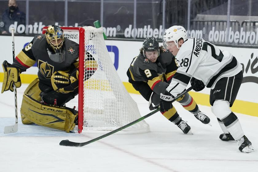 Los Angeles Kings center Jaret Anderson-Dolan (28) attempts a shot against Vegas Golden Knights goaltender Marc-Andre Fleury (29) during the first period of an NHL hockey game Friday, Feb. 5, 2021, in Las Vegas. (AP Photo/John Locher)