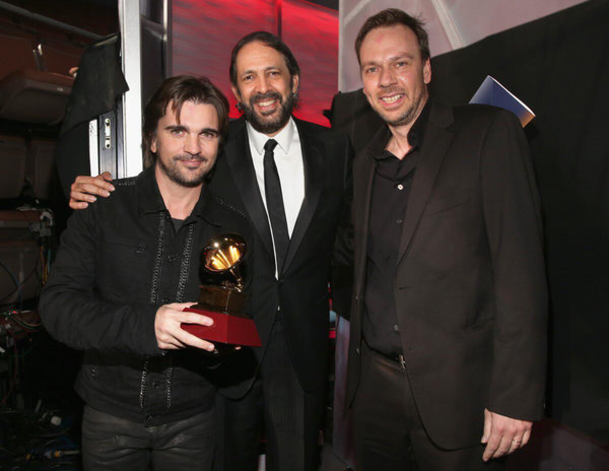 Juanes, Juan Luis Guerra, and Gustavo Borne at the Latin Grammy Awards at the Mandalay Bay Events Center in Las Vegas on Thursday.