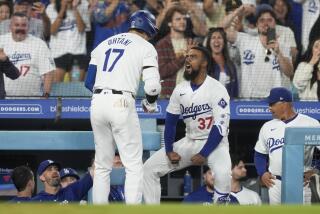 Los Angeles Dodgers designated hitter Shohei Ohtani, left, celebrates his go-ahead two-run home run with Teoscar Hernandez during the seventh inning of a baseball game against the Arizona Diamondbacks, Tuesday, July 2, 2024, in Los Angeles. (AP Photo/Ryan Sun)