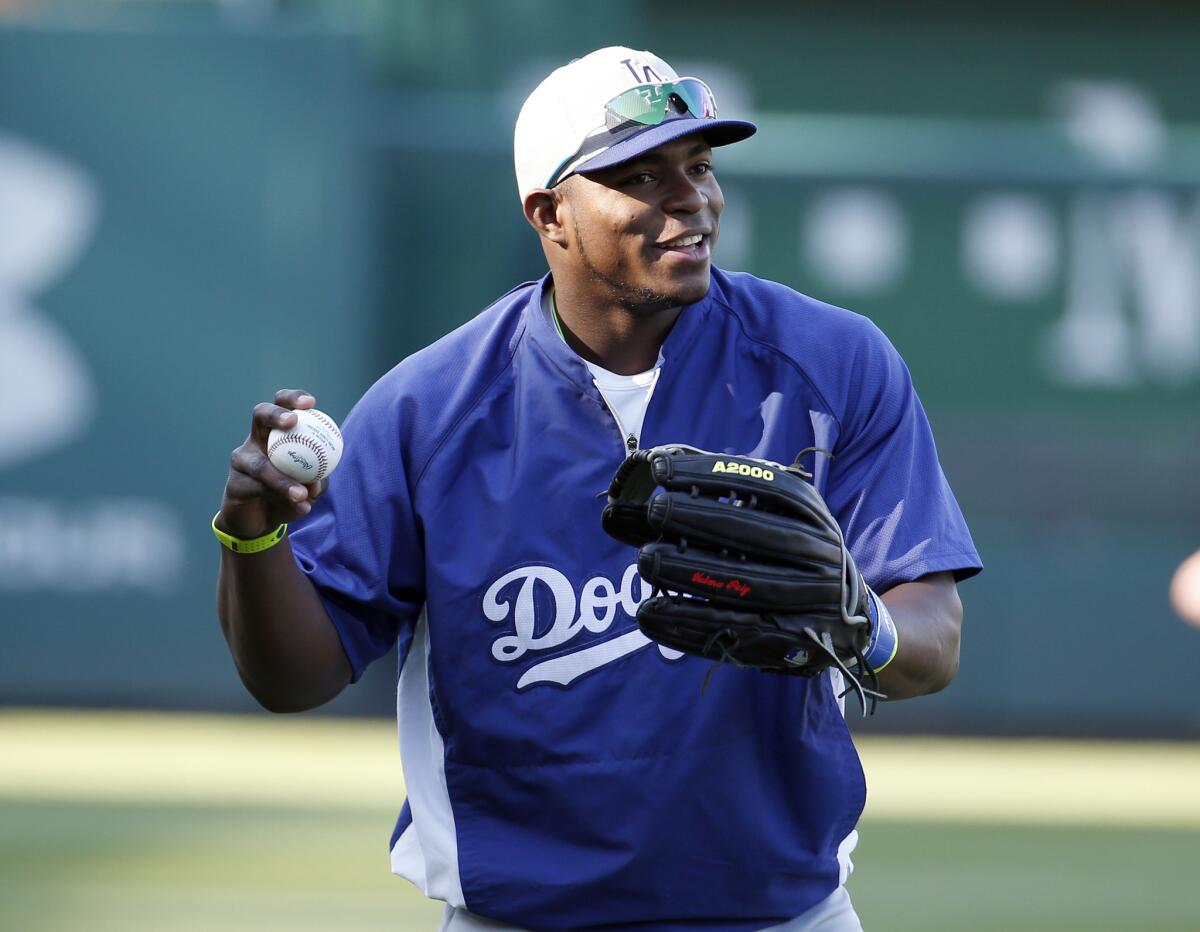 Dodgers outfielder Yasiel Puig is back in the lineup Wednesday in Washington, D.C., but rain has already delayed his return at least 40 minutes.