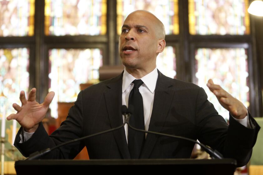 Democratic presidential candidate, Sen. Cory Booker, D-N.J., speaks about gun violence and white supremacy in the sanctuary of Mother Emanuel AME on Wednesday, Aug. 7, 2019, in Charleston, S.C. The church has become synonymous with hate-fueled attacks on people of faith, where nine black Bible study participants were slain in a 2015 racist attack. (AP Photo/Mic Smith)