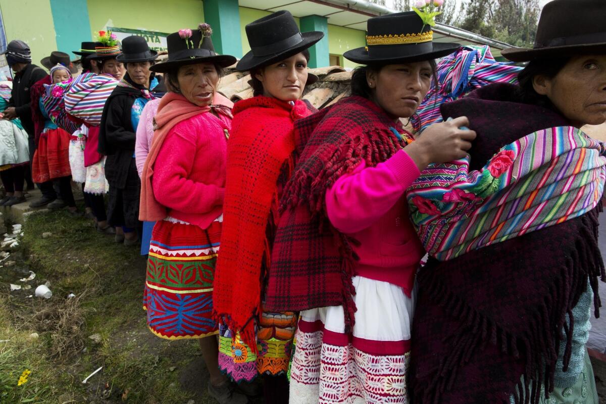 Quechua women stand in line to vote in Uchuraccay, Peru, on April 10, 2016.
