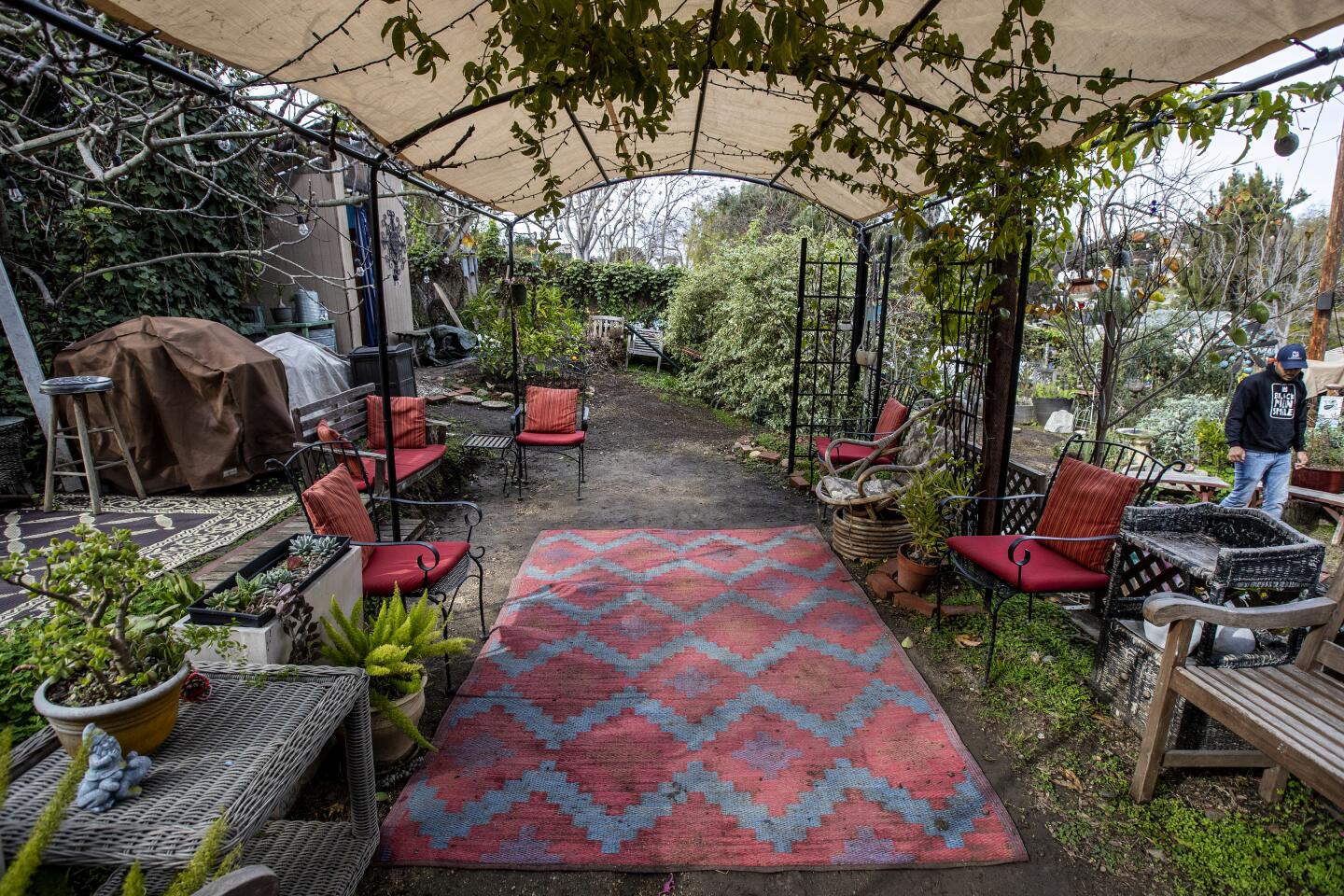 Covered seating area with an outdoor rug