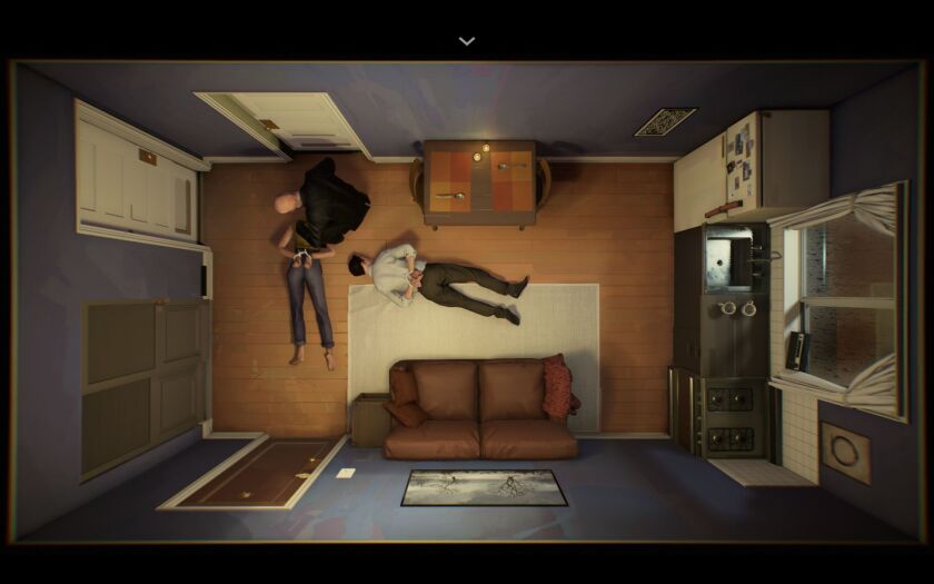 An image of a room looking from above with two people lying on the floor and a third person leaning over one of them