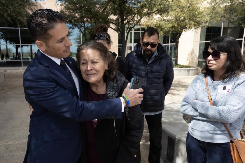 LANCASTER, CA- MARCH 29: Deputy Dist. Atty. Jonathan Hatami hugs Eva Hernandez, Noah Cuatro's great-grandmother following a sentencing hearing at Michael Antonovich Antelope Valley Courthouse in Lancaster, CA on Friday, March 29, 2024. The family felt like justice has been served. Other family members at the hearing were Maggie Hernandez, right, great-aunt; Matthew Hernandez, great-uncle, and family friend Crystal Wright, rear left. Noah Cuatro was tortured and killed in 2019. The parents Jose Cuatro and Ursula Juarez pleaded no contest. (Myung J. Chun / Los Angeles Times)