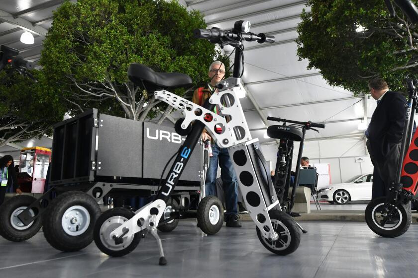 The URB-E electric folding bicycle is on display inside the Technology Pavilion at the 2017 LA Auto Show in November 28, 2017 in Los Angeles, California, before the event opens to the public running from December 1-10,2017. (Photo by FREDERIC J. BROWN / AFP) (Photo by FREDERIC J. BROWN/AFP via Getty Images)