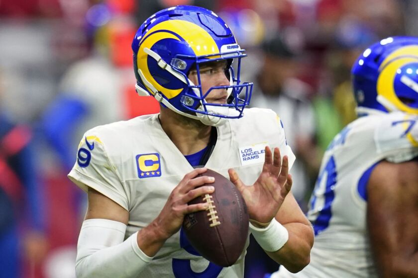 Los Angeles Rams quarterback Matthew Stafford (9) looks to pass against the Arizona Cardinals.
