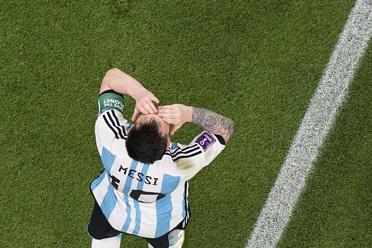 Argentina's Lionel Messi celebrates after scoring his side's opening goal during the World Cup