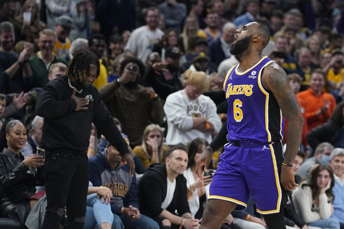 Lakers star LeBron James reacts after making a shot.