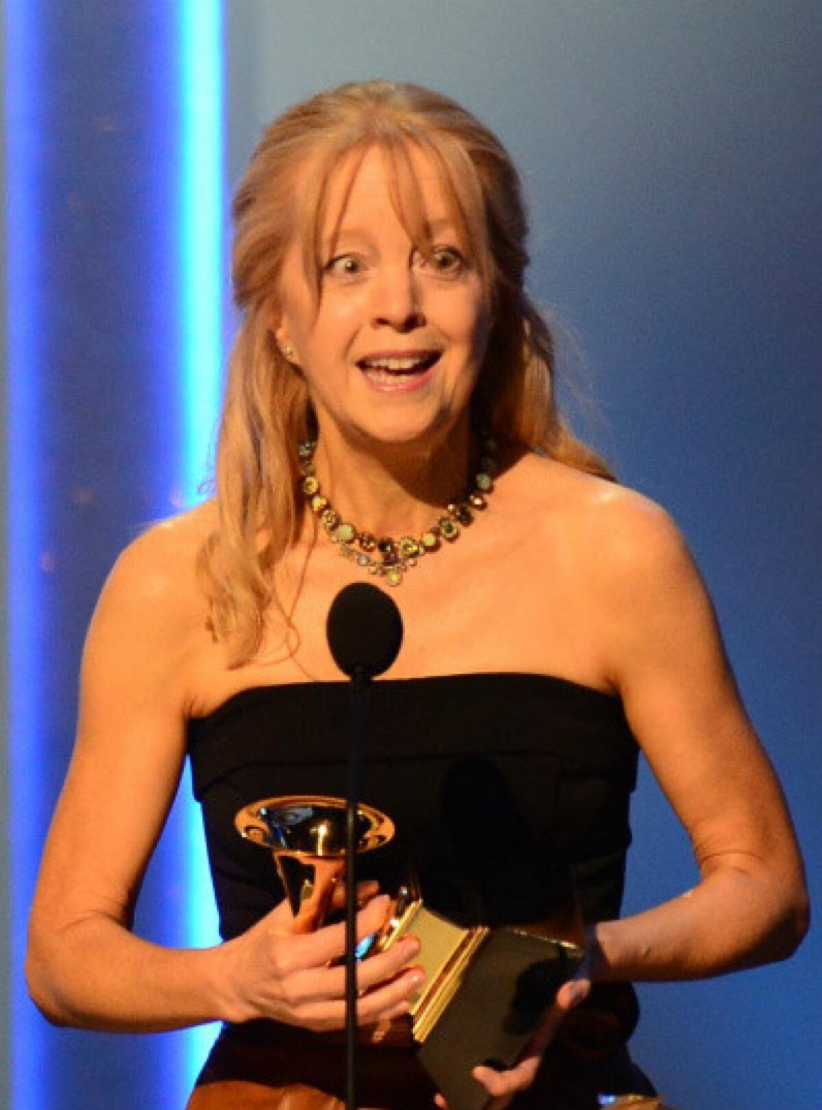 Maria Schneider accepts her Grammy Award for contemporary classical composition for "Winter Morning Walks" at the Nokia Theatre in Los Angeles.