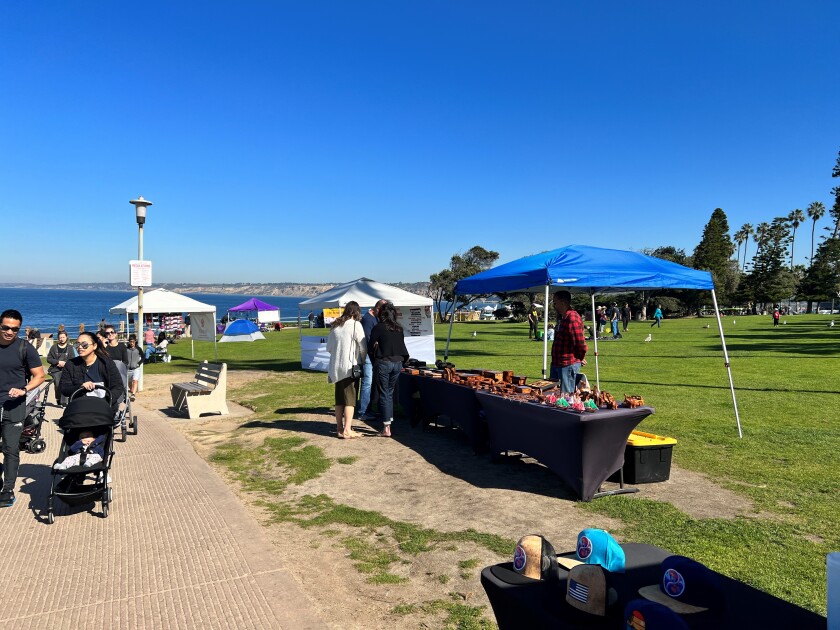 Vendors offer their goods to visitors at Scripps Park near La Jolla Cove in February.