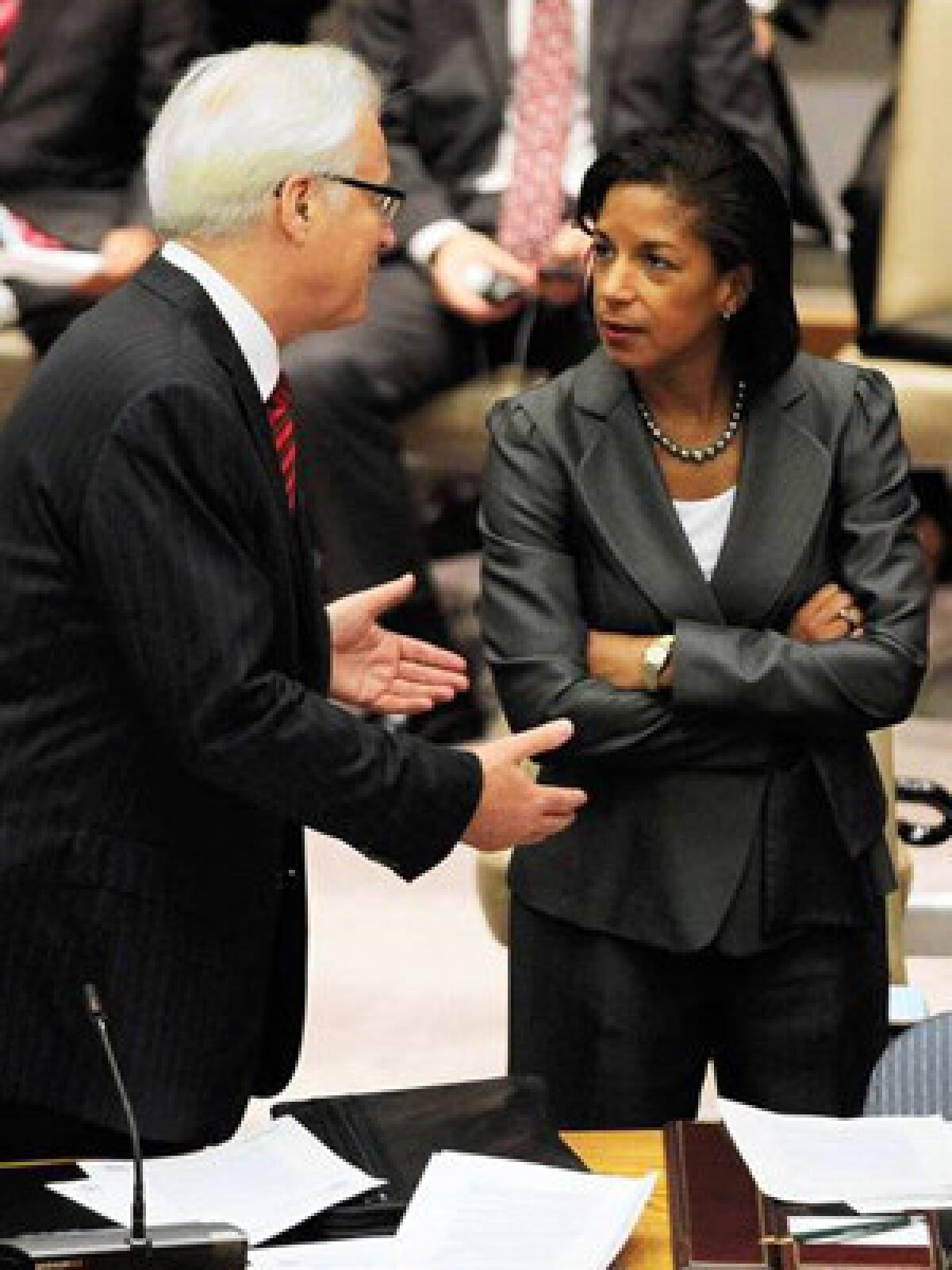 At the United Nations, Russian Ambassador Vitaly Churkin speaks to U.S. counterpart Susan Rice before a vote on a U.N. Security Council resolution on Syria. Russia, along with China, vetoed the sanctions resolution.