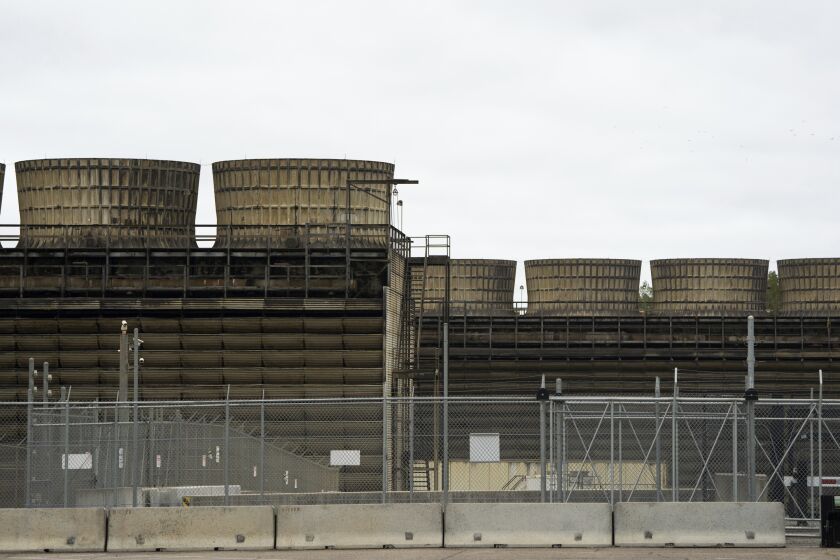 FILE - Cooling towers release heat generated by boiling water reactors at Xcel Energy's Nuclear Generating Plant on Oct. 2, 2019, in Monticello, Minn. Minnesota regulators said Thursday, March 16, 2023, that they're monitoring the cleanup of a leak of 400,000 gallons of radioactive water from Xcel Energy's Monticello nuclear power plant in late November 2022. The company said there's no danger to the public. (Evan Frost/Minnesota Public Radio via AP, File)