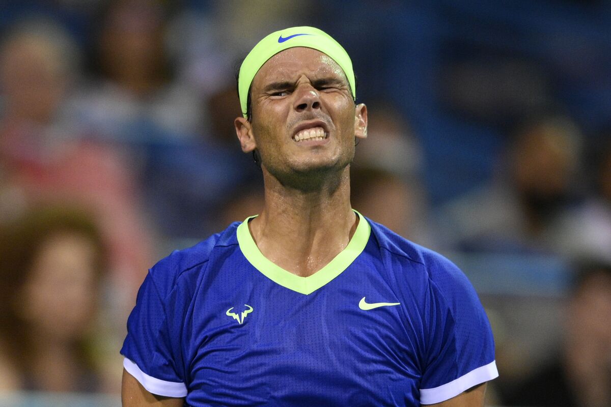 Rafael Nadal, of Spain, reacts during a match against Lloyd Harris, of South Africa, at the Citi Open tennis tournament Thursday, Aug. 5, 2021, in Washington. Harris won 6-4, 1-6, 6-4. (AP Photo/Nick Wass)