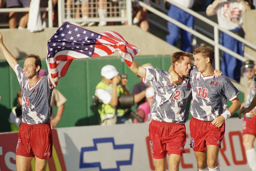 U.S. players Thomas Dooley, Mike Lapper and Mike Sorber celebrate their win over Colombia during the 1994 World Cup