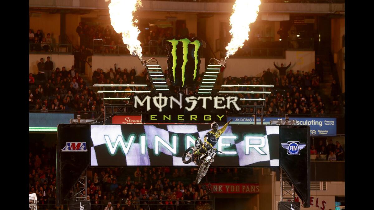 Jason Anderson, of Rio Rancho, NM, celebrates winning the 450SX Main Event of the Monster Energy AMA Supercross race at Angel Stadium in Anaheim, Calif., on Jan. 9, 2016