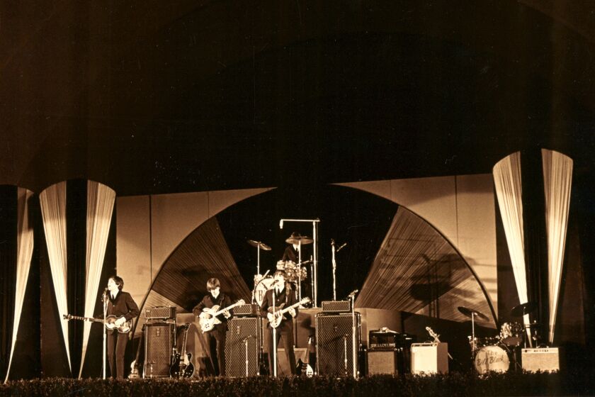 The Beatles performing during the August 23, 1964 concert.
