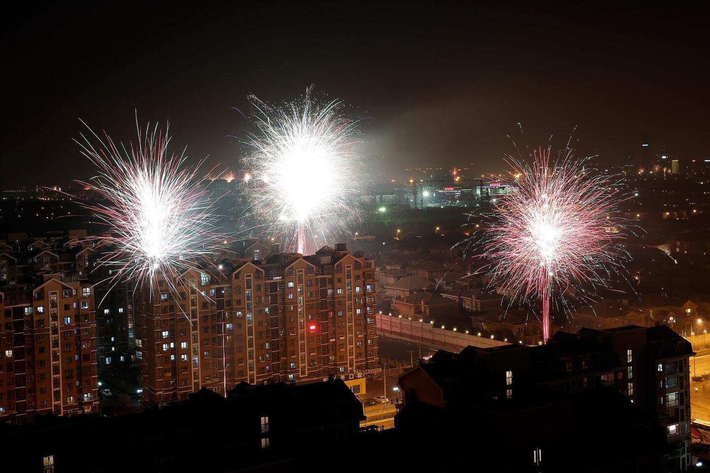 Fireworks in Beijing herald the arrival of the Year of Goat.