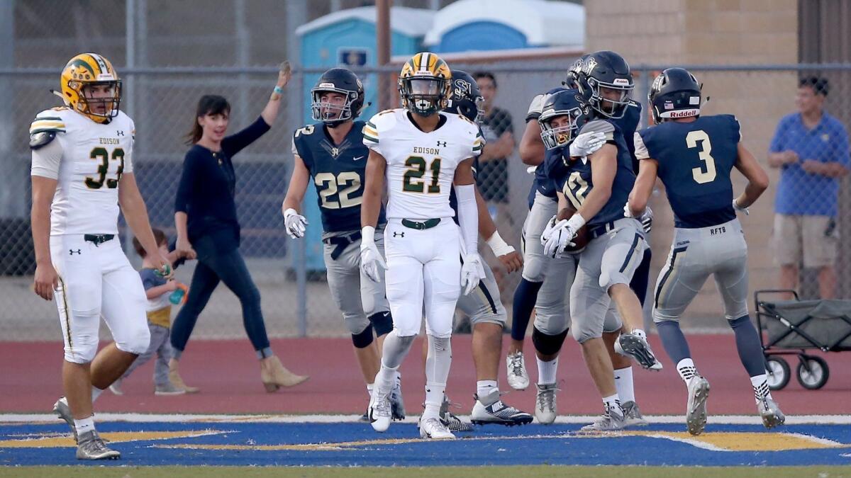 San Juan Hills High wide receiver Joey Hobert (12) celebrates his 41-yard touchdown catch in the first quarter against Edison on Friday.