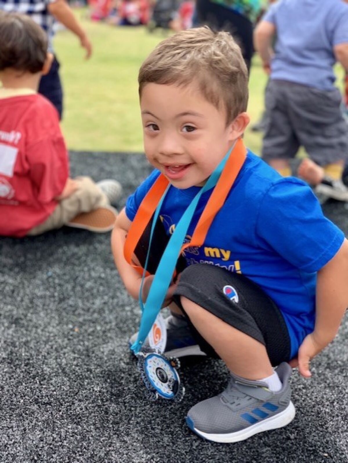Jennifer Candelario's son Mateo at a previous San Diego Donut Run. The family has participated every year since 2018.