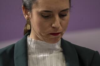 FILE - Spain's Equality Minister Irene Montero looks down during a press conference after an emergency meeting for a worrying surge of gender violence in Madrid, Spain, on Jan. 27, 2023. Spain's parliament passed laws on Thursday Feb. 16, 2023 expanding abortion and transgender rights for teenagers, while making Spain the first country in Europe entitling workers to paid menstrual leave. (AP Photo/Manu Fernandez, File)