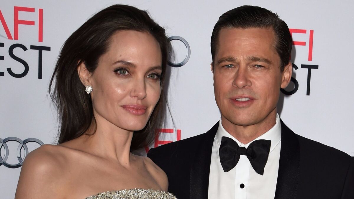 Angelina Jolie and Brad Pitt appear at the "By the Sea" premiere in November 2015.