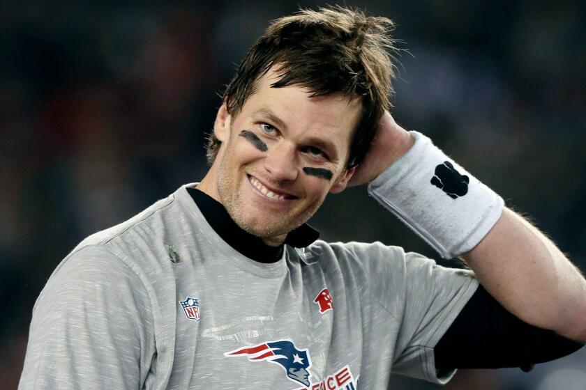 New England Patriots quarterback Tom Brady smiles after winning the AFC championship NFL football game 24-20 over the Jacksonville Jaguars, Sunday, Jan. 21, 2018, in Foxborough, Mass. (AP Photo/Charles Krupa)