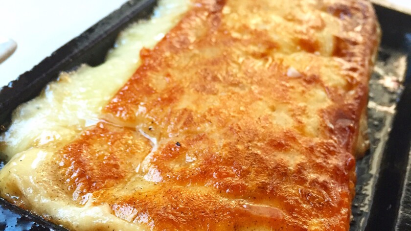 The saganaki from Ulysses Voyage restaurant in the Original Farmers Market at the Grove.