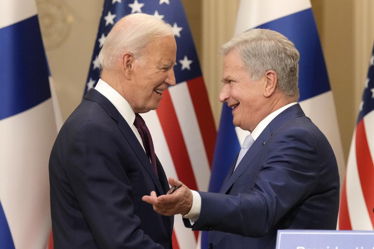 Finland's President Sauli Niinisto and President Biden smile after their news conference in Helsinki 