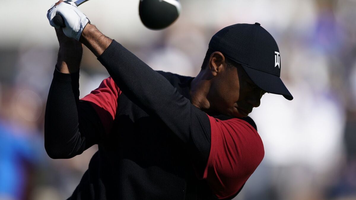 Tiger Woods tees off on the ninth hole during the third round of the Genesis Open at Riviera Country Club on Feb. 17.